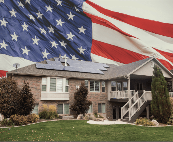 American flag and house with solar panels