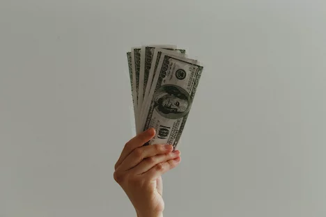 money hand holding money