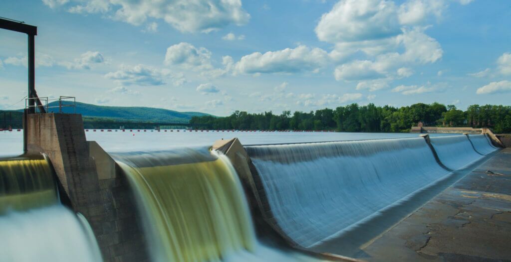 Hydropower representation through wall of dam reservoir