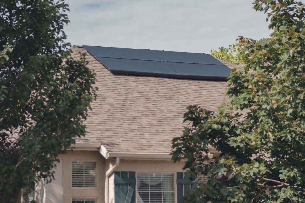 Four solar panels installed, together, on a singlle level house