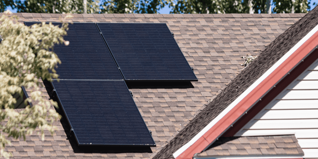 3 solar arrays installed on a residential property with brown shingles