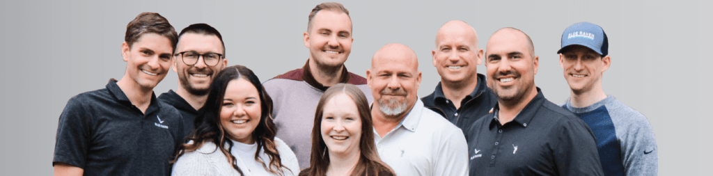 Nine Blue Raven Solar employees, standing in a group