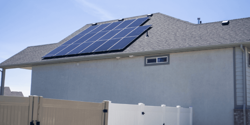17 panel system installed on side of house with blue skies in background