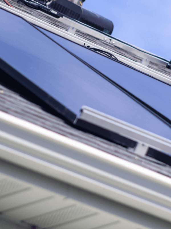 Solar panel array, installed on roof with specialized racking securing them to the roof