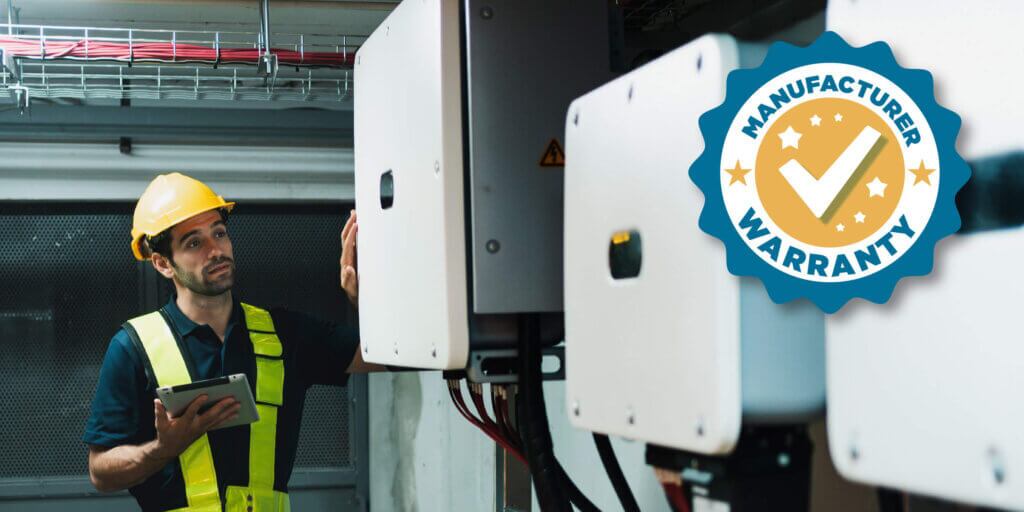 Inspector evaluating solar batteries, in a line, with a Manufacturer Warranty badge on the upper right hand side
