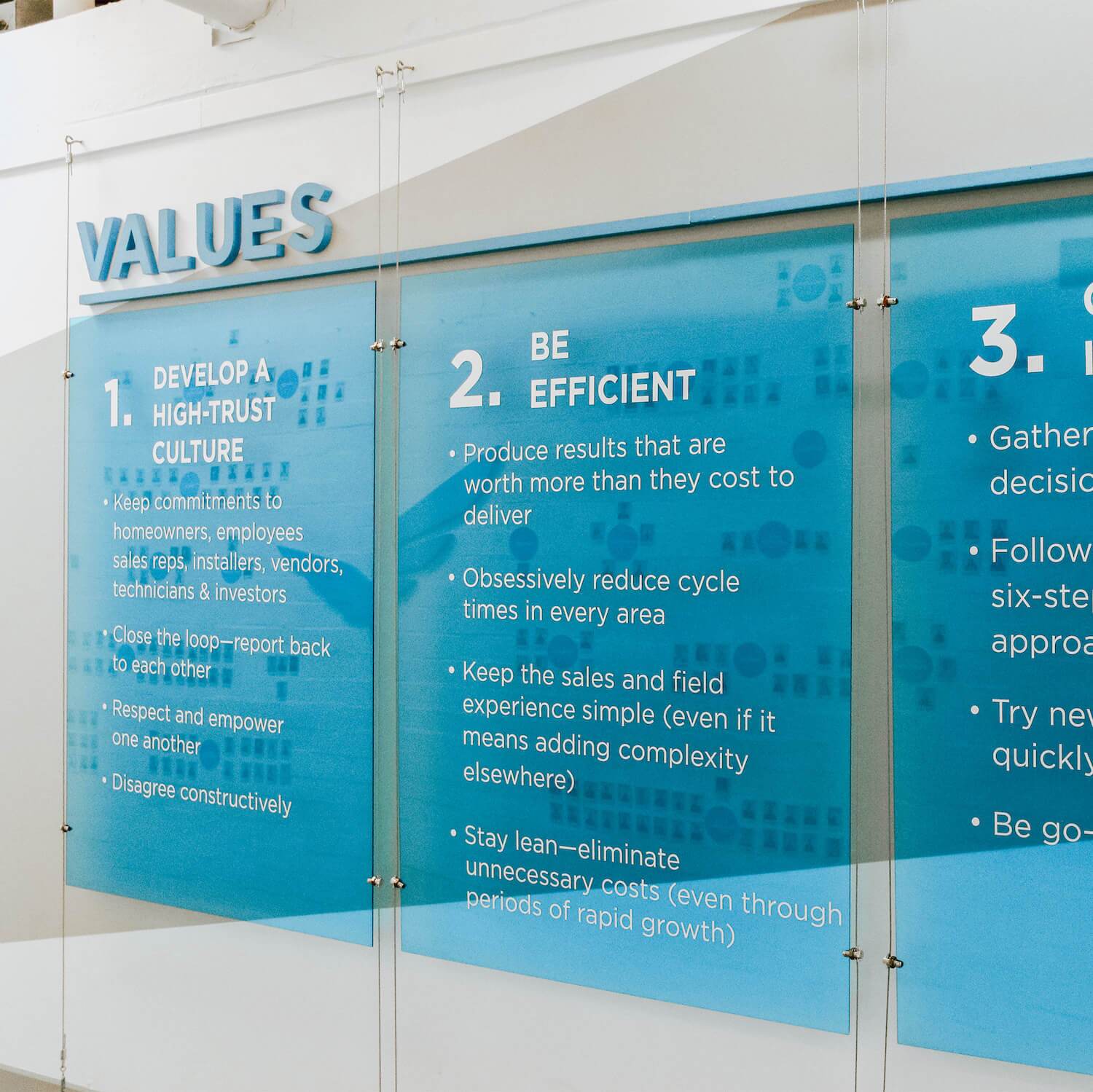 Blue Raven Solar values presented on the wall located at headquarters in Orem, UT