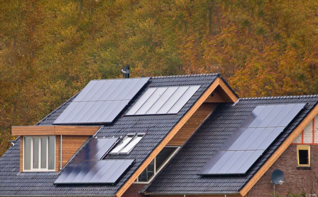 Modern roofline with variegated solar arrays installed and mounted to roof on different pitches