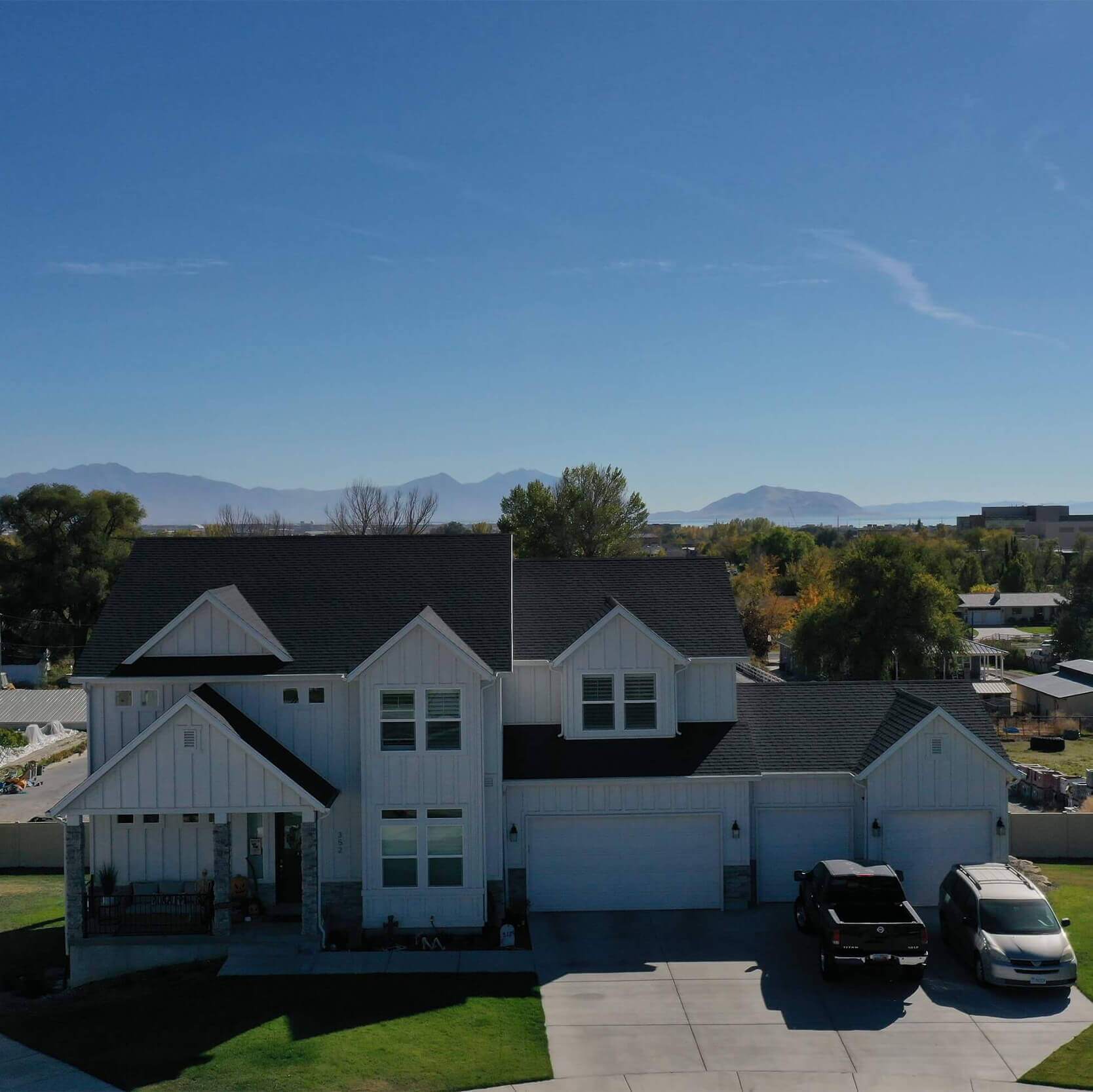 Exterior, front view of a white multi-level house