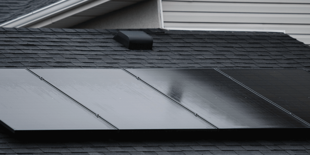 Best Residential Solar Panels-05 Black, monocrystalline solar panels installed in a row n a black, asphalt, shingle roof