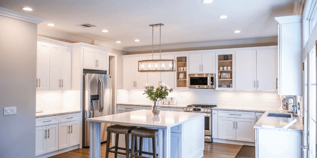 White, modern kitchen with natural accents