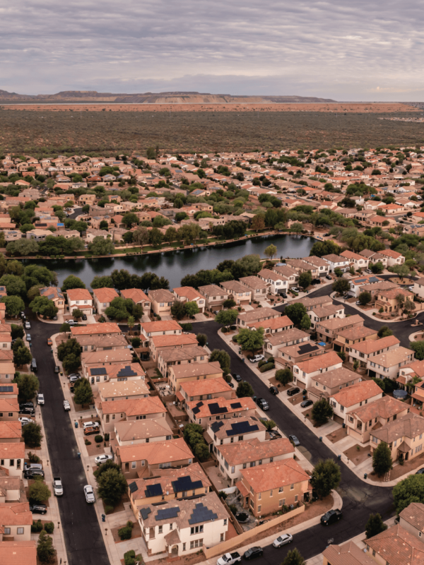 Aerial view of dense neighborhoods with a body of water in the middle