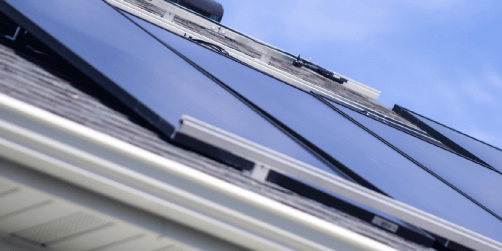 Solar panel array, installed on roof with specialized racking securing them to the roof