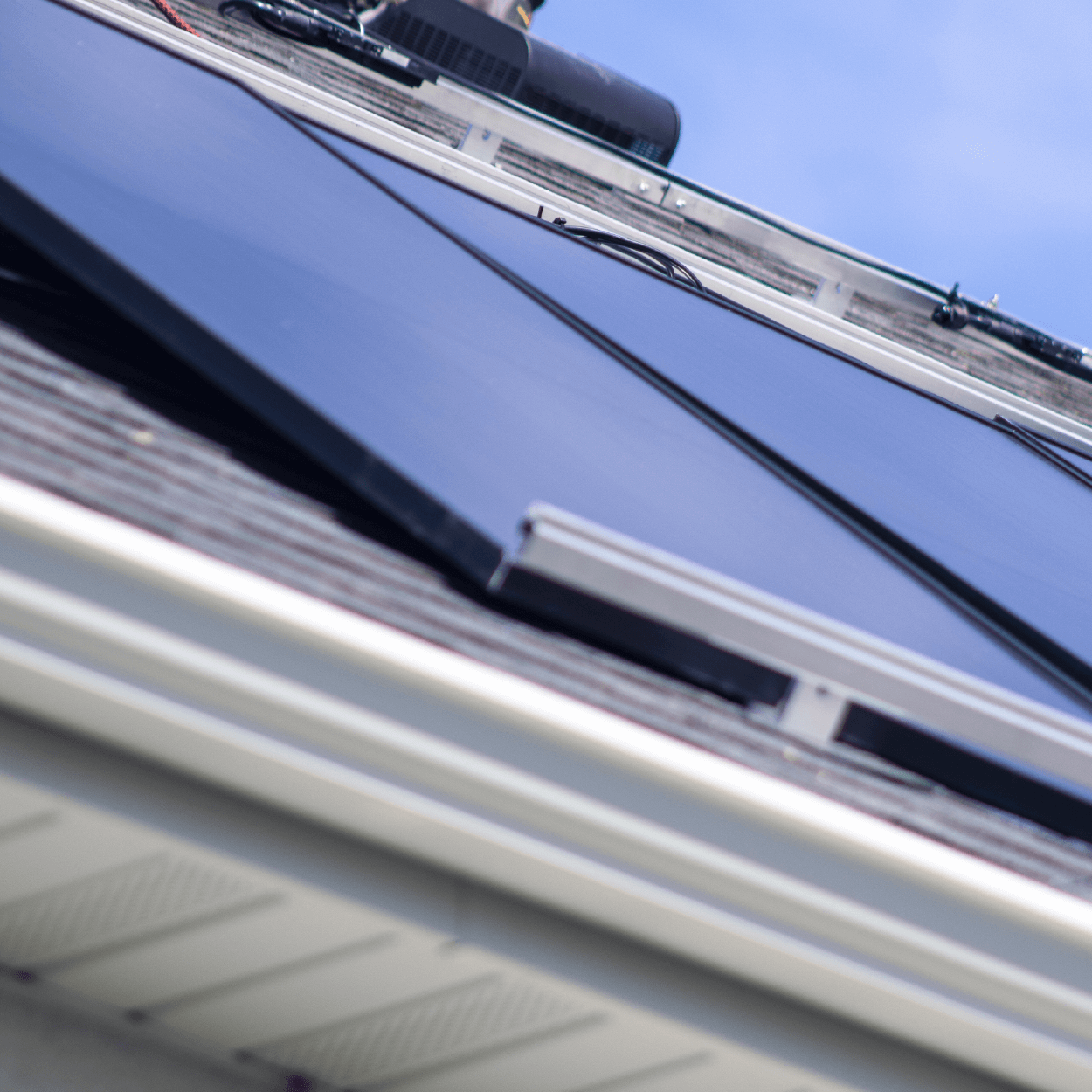 Solar panel array, installed on roof with specialized racking securing them to the roof