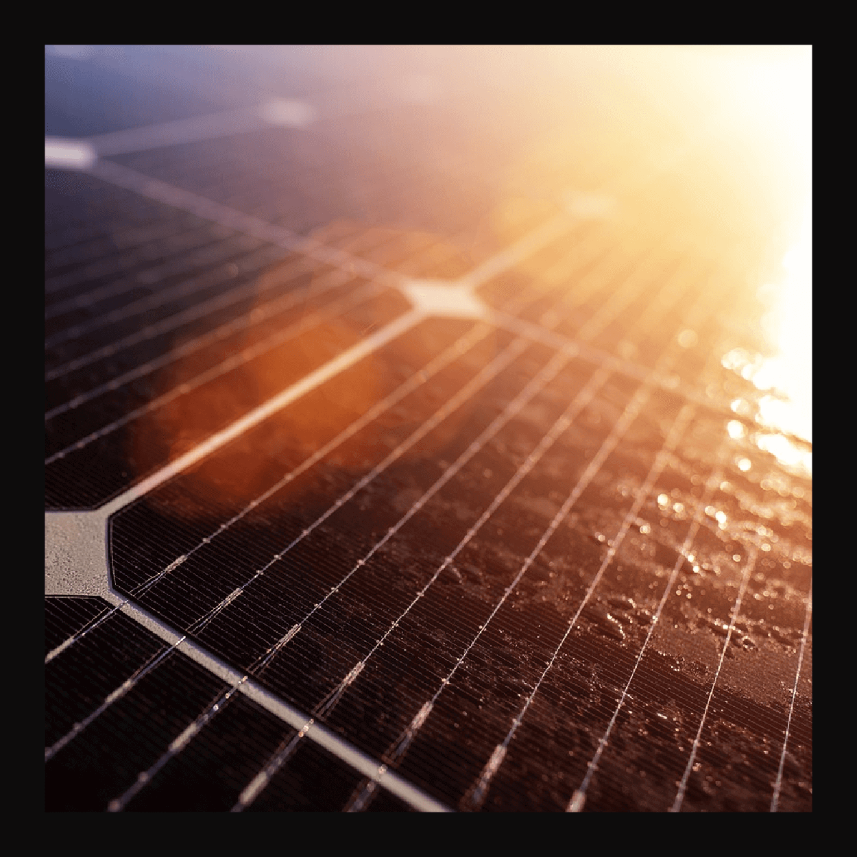 Solar panel cells with sun flare in the top right corner