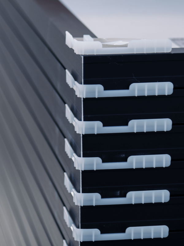 Stack of solar panels with separators, used during transportation to installation location