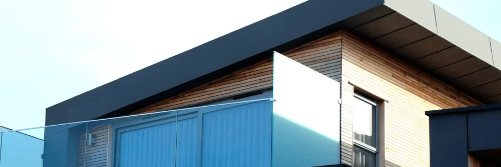 Modern home with minimal roof slope and small slat exterior