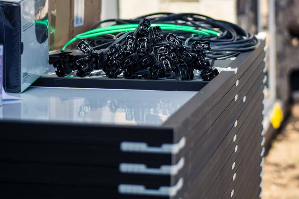 stack of different solar panels options and other necessary equipment required for rooftop solar installation