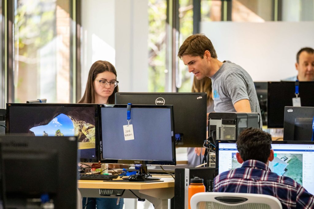 Blue-Raven-Solar-CEO-Working-with-Employees Blue Raven Solar CEO, Ben Peterson, working one-on-one with specific employees at the corporate office