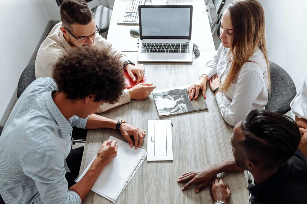 Group-of-4-Employees-in-a-Conference-Room