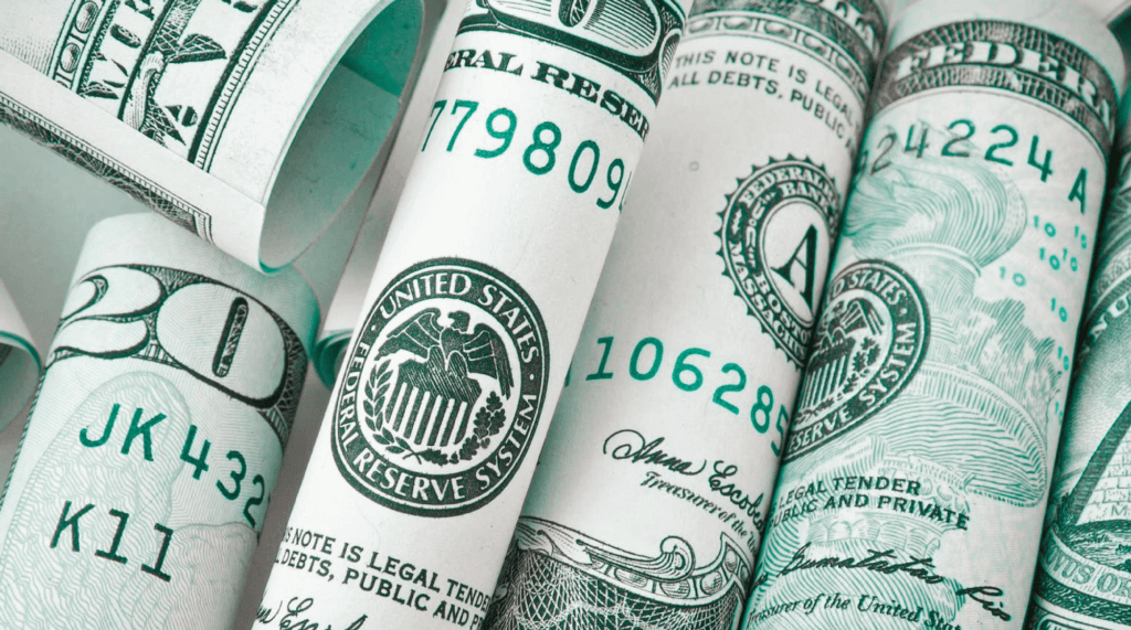 Are Solar Panels Worth It-02 Twenty dollar bills, United States currency rolled up and placed next to each other