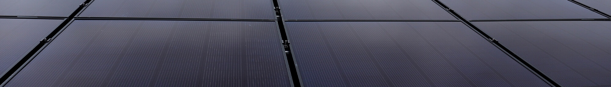 Solar-Panels-Rendering-Installed-on-Roof-Skinny Solar panels installed close together in a grid pattern