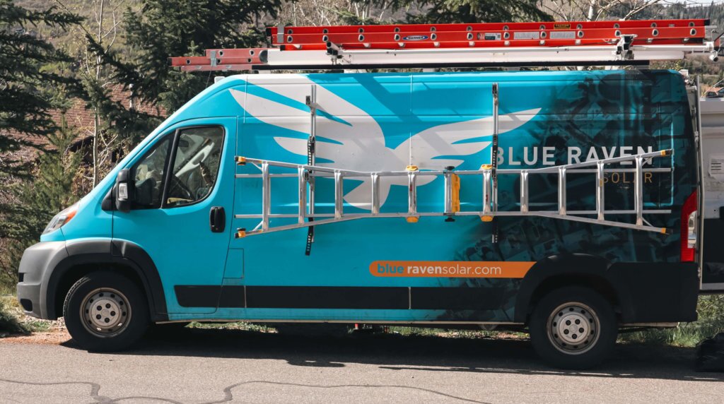 Blue Raven Solar installation van with ladders attached on sides and top