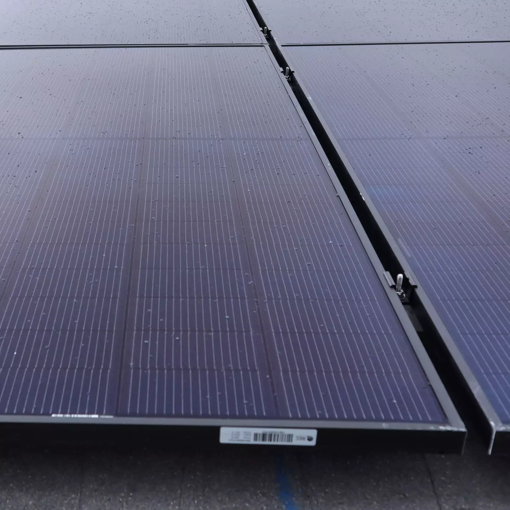 Up close view of solar panels installed on roof, in a grid