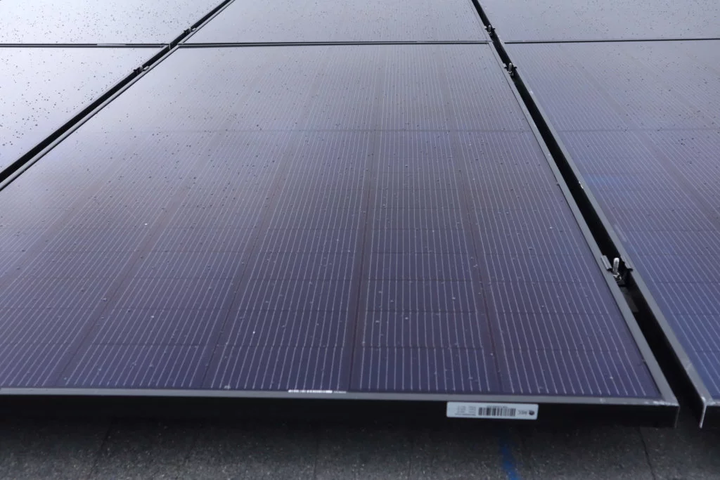 Up close view of solar panels installed on roof, in a grid