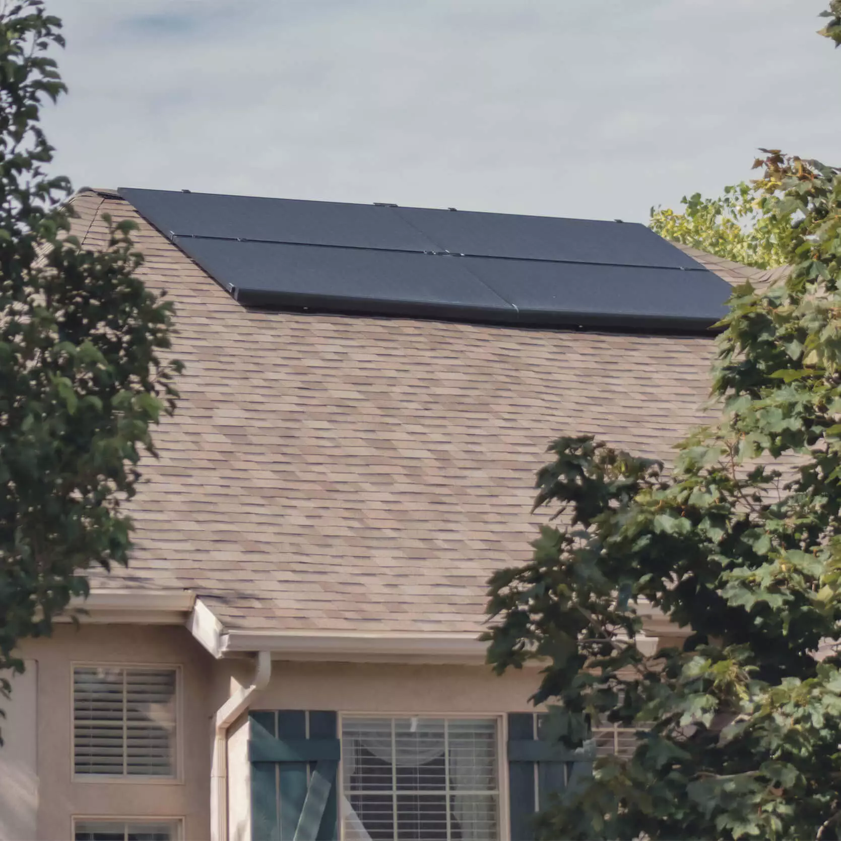 Four solar panels installed, together, on a singlle level house