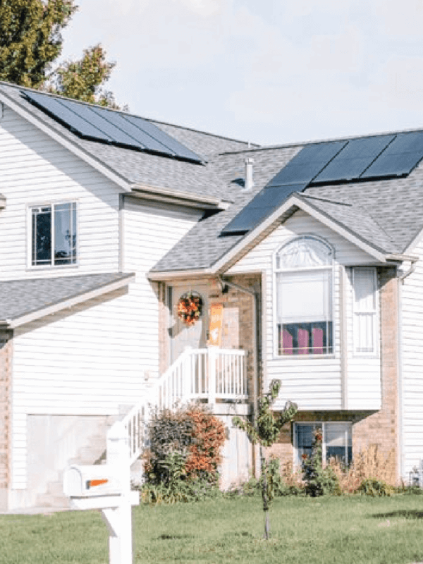 Multi-level house with solar panel system installed on different roof pitches