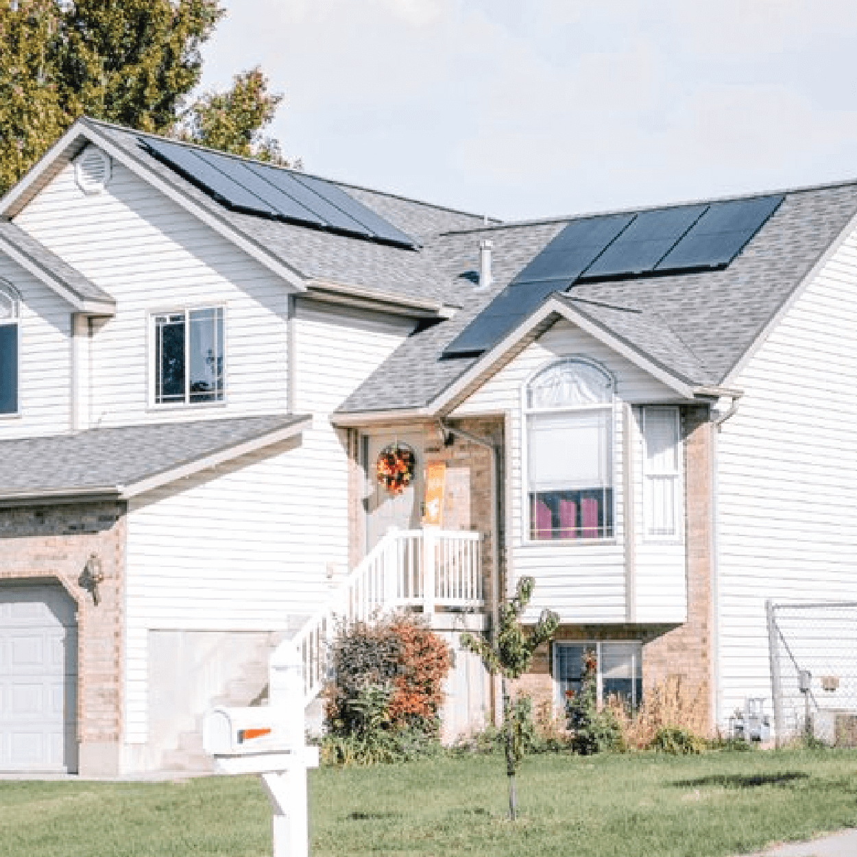 Multi-level house with solar panel system installed on different roof pitches