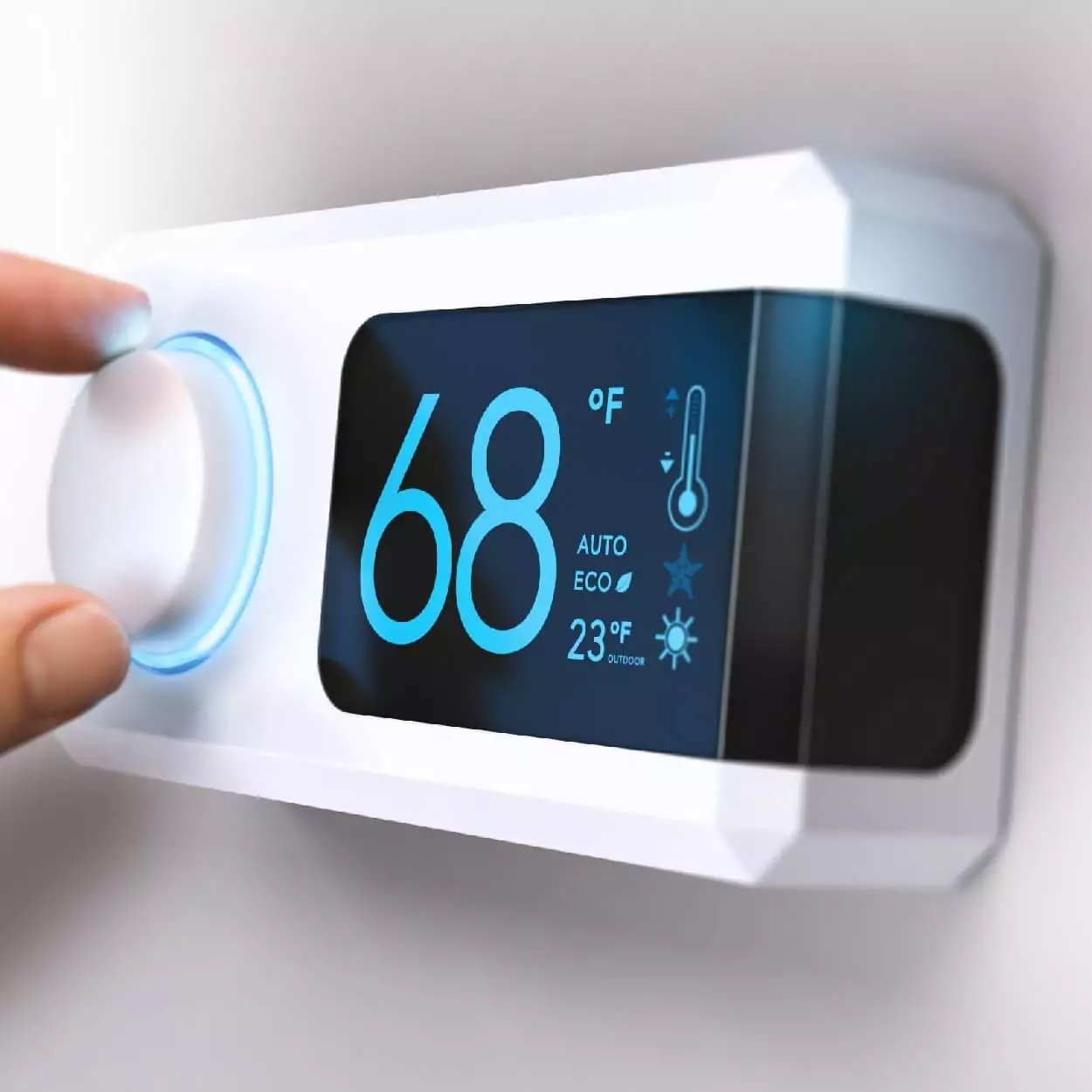 Smart thermostat featuring 68 degrees installed on white wall and a hand adjusting the knob