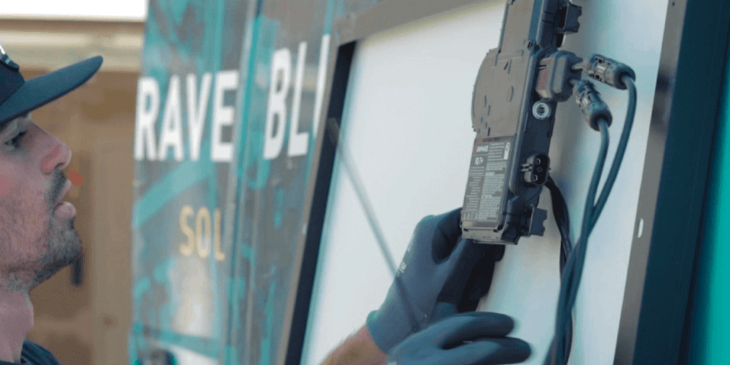 Blue Raven Solar installer installing an Enphase microinverter to the back of a solar panel