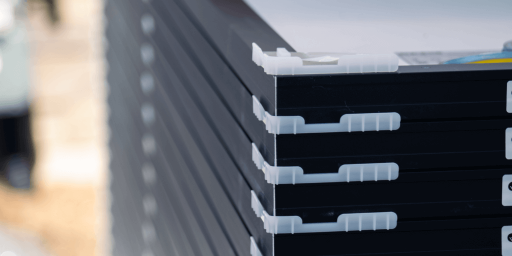 A Guide to Solar Panel Efficiency and Performance-03 Stack of solar panels with separators, used during transportation to installation location