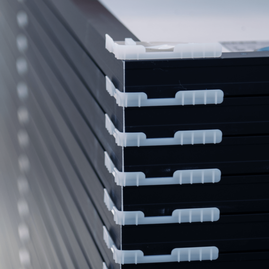 Stack of solar panels with separators, used during transportation to installation location