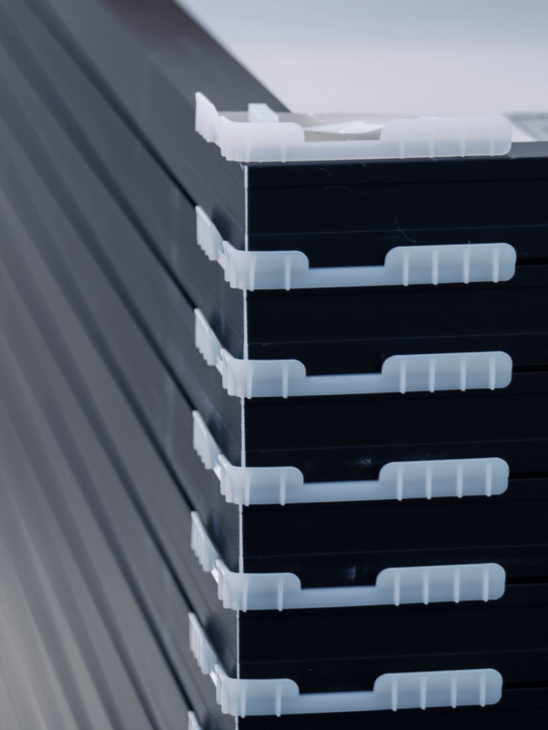 Stack of solar panels with separators, used during transportation to installation location